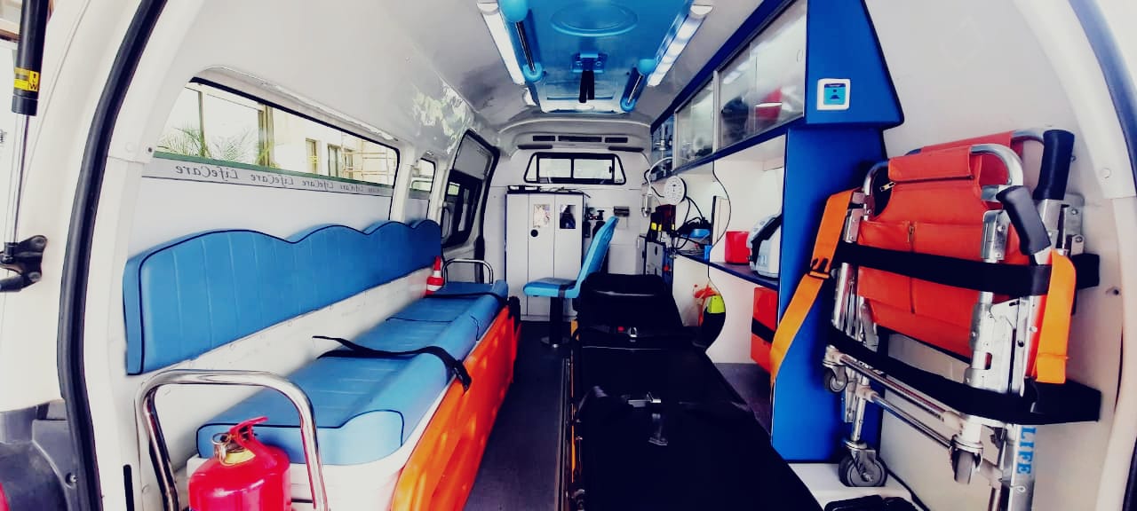 Trained paramedics in ambulance providing emergency care